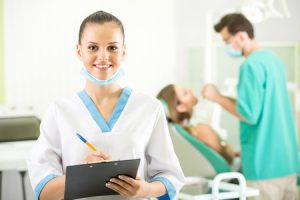 dentist and patient on background