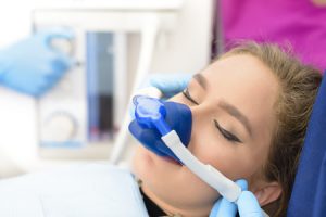 woman inhalation sedation at dental clinic